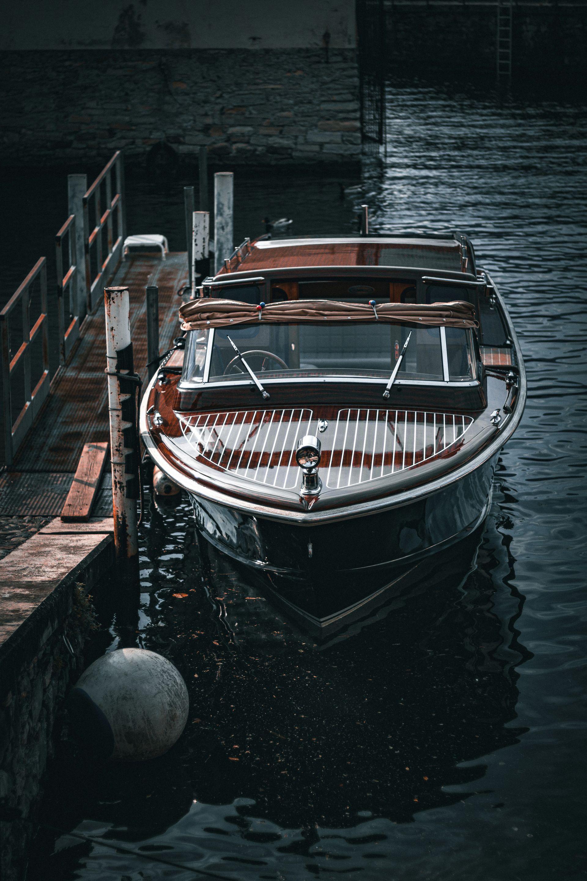 a boat docked at a dock in the water